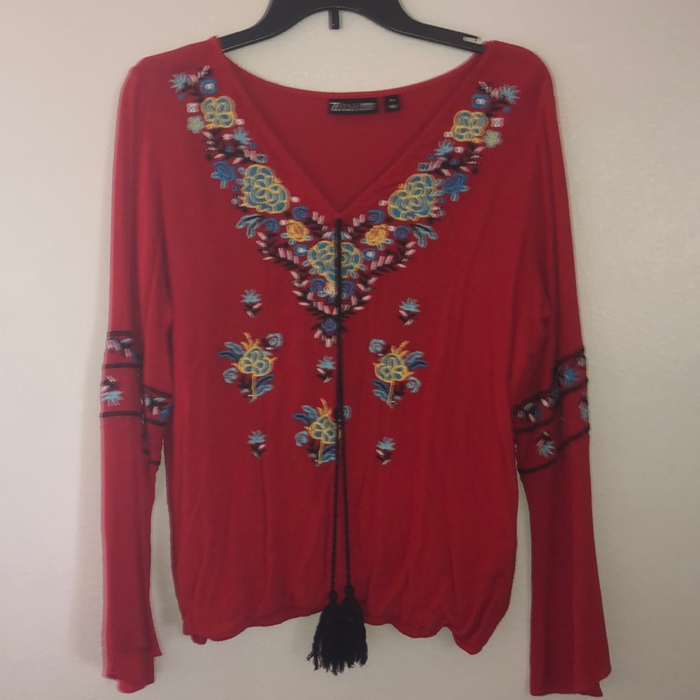 Red shirt w/ flower designs